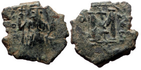 Constans II, AE, Follis, (Bronze, 3.13 g.20 mm.) Uncertain mint. 641-668 AD.
Obv: [EN T]V[TO NIKA], Constans, beardless, crowned and wearing chlamys, ...