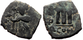 Constans II, AE, Follis. (Bronze, 3.80 g. 20 mm.) Constantinople, 641-668 AD.
Obv: [EN] TV[TO NIKA], Constans beardless, crowned and wearing chlamys, ...