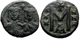 Nicephorus I. AE, Follis. (Bronze, 5.05 g. 21 mm) Constantinople. 802-811 AD.
Obv: No legend. crowned busts facing of Nicephorus with short beard, on ...