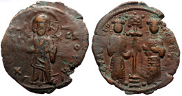 Constantine X Ducas, with Eudocia (1059-1067) AE Follis (Bronze, 5.72g, 29mm) Constantinople. 
Obv: +ЄΜΜΑΝΟVHΛ Christ Emmanuel standing facing on foot...