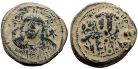 Michael VII Ducas (1071-1078) AE follis (Bronze, 6.47g, 26mm) Constantinople 
Obv: Nimbate bust of Christ facing, wearing pallium and colobium, right ...
