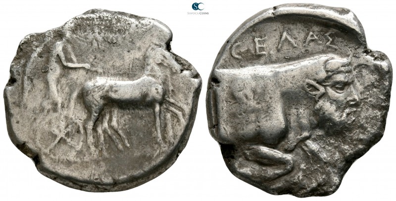 Sicily. Gela 450-440 BC. 
Tetradrachm AR

26mm., 15,95g.

Charioteer, holdi...