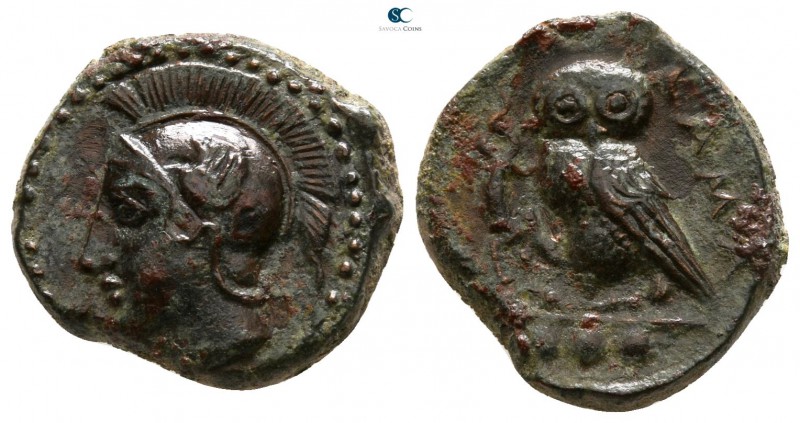 Sicily. Kamarina 420-405 BC. 
Tetras Æ

13mm., 3,09g.

Head of Athena left,...