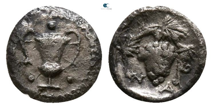 Sicily. Naxos 461-430 BC. 
Tetras AR

5mm., 0,17g.

Kantharos; around, thre...