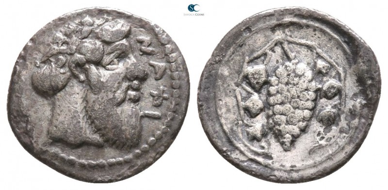 Sicily. Naxos 461-430 BC. 
Litra AR

11mm., 0,60g.

Head of Dionysos right,...