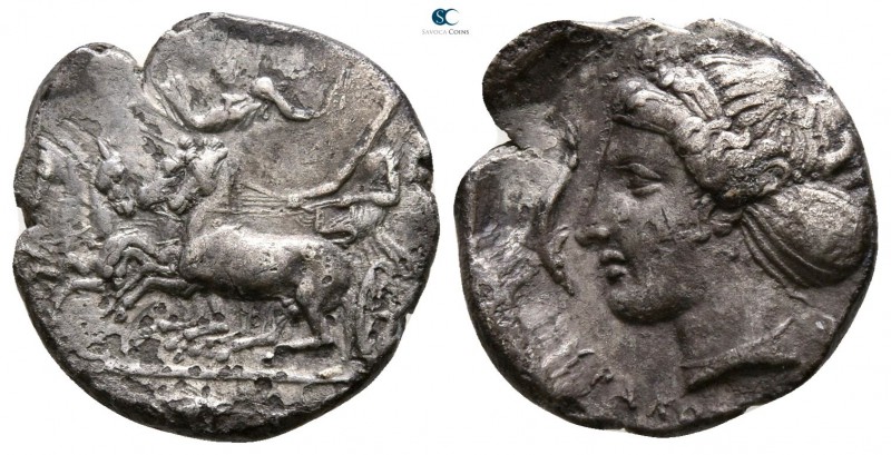 Sicily. Syracuse 410-400 BC. 
Hemidrachm AR

13mm., 2,02g.

Charioteer driv...