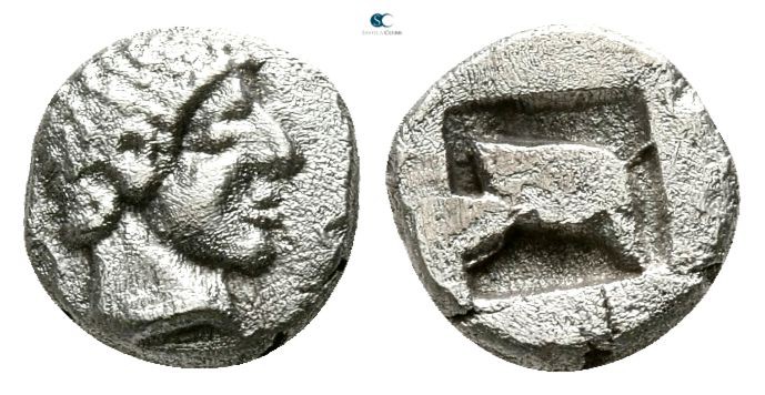 Macedon. Scione 480-453 BC. 
Hemiobol AR

6mm., 0,34g.

Male head to right ...