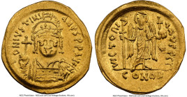 Justinian I the Great (AD 527-565). AV solidus (21mm, 4.36 gm, 6h). NGC Choice XF 5/5 - 4/5, clipped. Constantinople, 3rd officina, ca. AD 545-565. D ...