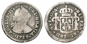Carlos IV (1788-1808). 1/2 real. 1789. Santiago. DA. (Cal-1333). Ag. 1,60 g. Busto de Carlos III y ordinal IV. Rara. BC/BC+. Est...110,00.