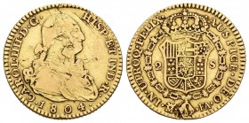 Carlos IV (1788-1808). 2 escudos. 1804. Madrid. FA. (Cal-347). Au. 6,67 g. Hojas en anverso. BC+. Est...200,00.