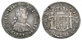 Fernando VII (1808-1833). 1/2 real. 1812. México. HJ. (Cal-1341). Ag. 1,55 g. Busto imaginario. Oxidaciones superficiales. Ligeramente alabeada. MBC. ...