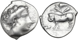 Greek Italy. Central and Southern Campania, Nola. AR Nomos, c. 400-385 BC. Obv. Diademed head of nymph right. Rev. Man-headed bull walking left; above...