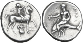 Greek Italy. Southern Apulia, Tarentum. AR Nomos, c. 272-240 BC. Obv. Nude youth on horseback right, crowning horse and holding rein; monogram to left...