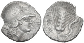 Greek Italy. Southern Lucania, Metapontum. AR Diobol, c. 325-275 BC. Obv. Helmeted head of Athena right. Rev. Grain ear with leaf to right; cornucopia...