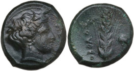Greek Italy. Southern Lucania, Metapontum. AE Obol, c. 400-340 BC. Obv. Head of Demeter right. Rev. OBOΛOΣ. Grain ear; poppy head to right. HN Italy 1...
