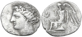Greek Italy. Bruttium, Terina. AR Drachm, c. 300 BC. Obv. Head of the nymph Terina left; triskeles behind neck. Rev. Nike seated left on plinth, holdi...