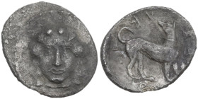 Sicily. Eryx. AR Litra, c. 425-420 BC. Obv. Facing head of Aphrodite. Rev. ERVKINON (retrograde). Hound standing right, head turned left. HGC 2 297; S...