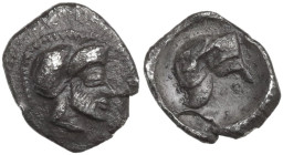 Sicily. Himera. AR Litra, c. 450-440 BC. Obv. Male head right, bearded and helmeted. Rev. Helmet without crest, decorated with volute; [below, symbol?...