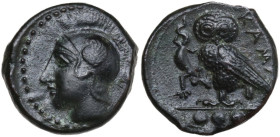 Sicily. Kamarina. AE Tetras or Trionkion, c. 410-405 BC. Obv. Head of Athena left, wearing crested Corinthian helmet decorated with a wing. Rev. KAMA....