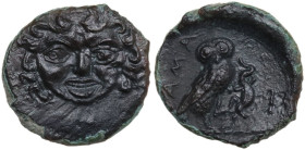 Sicily. Kamarina. AE Onkia, c. 420-410 BC. Obv. Gorgoneion facing, tongue slightly protruding. Rev. KAMA. Owl standing right, head facing, grasping li...