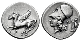 Corinthia. Corinth. Stater. 375-345 a.C. (Pegasi-376). (Sng Cop-121). (Ravel-1056). Anv.: Pegasos flying left, Ϙ below. Rev.: Helmeted head of Athena ...