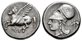 Corinthia. Corinth. Stater. 345-307 a.C. (Pegasi-432). (Hgc-4,1848). Anv.: Pegasos flying to left; Ϙ below. Rev.: Head of Athena to left, wearing laur...