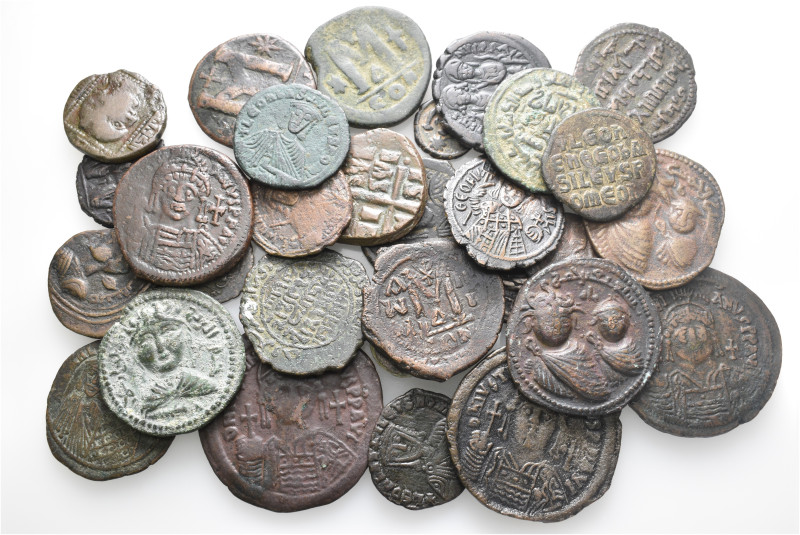 A lot containing 30 bronze coins. Including: Byzantine and Islamic. Fine to very...