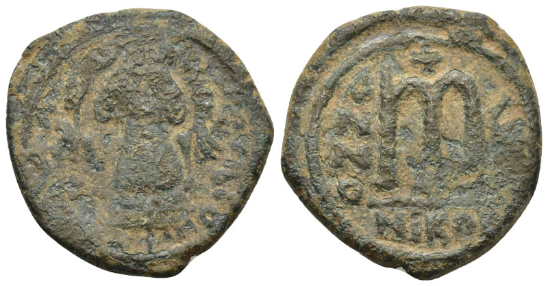 Maurice Tiberius AD 582-602. AE Follis Nikomedia. (12.1 Gr. 27mm.) 
Helmeted and...