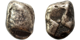 GREEK. Uncertain. Circa 6-5th century BC. Siglos or ingot (?) (silver, 6.04 g, 15 mm). Blank. Rev. Incuse pattern. Nearly very fine.