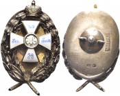 RUSSIA. Nicola II, 1896-1917. Distintivo con il monogramma dello Zar. Ag con smalti gr. 27,20 mm 54 Dr. Distintivo la cui forma è costituita da una gh...