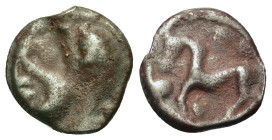 Gaul, the Senones, c. 100-50 BC. Æ Potin Unit (17mm, 3.5g). Stylized helmeted male head l. R/ Stylized horse prancing l.; four pellets above, pellet t...