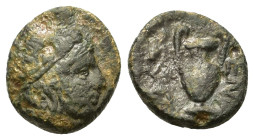 Macedon, Mende. c. 400-350 BC. Æ Chalkous (10mm, 1.23 g ). Head of youthful Dionysos to right, wearing ivy wreath. R/MIN Amphora with tall handles; to...