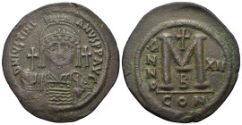Justinian I (527-565). Æ 40 Nummi (41,8mm, 21,5g). Constantinople, year 12 (AD 538/9). Helmeted and cuirassed bust facing, holding globus cruciger and...