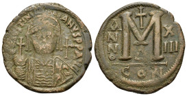 Justinian I (527-565). Æ Follis (36,3mm, 21,7g). Constantinople. Cuirassed and helmeted facing bust, holding globus cruciger; cross in right field. R/...