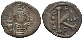 Justinian I (527-565). Æ 20 Nummi (27mm, 8.51g, 11h). Theoupolis (Antioch), year 32 (558/9). Helmeted and cuirassed bust facing, holding globus crucig...