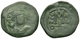 Maurice Tiberius (582-602). Æ 40 Nummi 29,6mm, 11,5g). Nicomedia, year 15 (AD 596/7). Helmeted and cuirassed bust facing, holding globus cruciger and ...