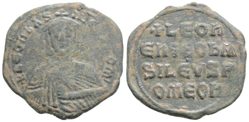 Leo VI Æ Nummus. Constantinople, AD 886-912. + LEON bASILEVS ROM, crowned facing...