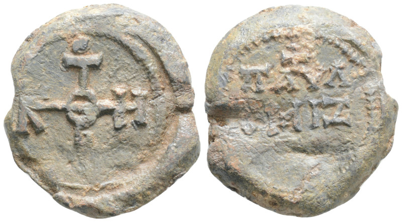 Byzantine Lead Seal ( 6th century)
Obv: Cruciform monogram
Rev: (two ) lines o...