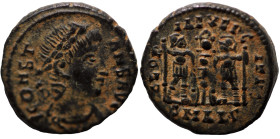 Constans. (346-349 AD). Æ Follis. (15mm, 1,96g) Antioch. Obv: DN FL CONSTANTIVS AVG. pearl-diademed bust of Constans right. Rev: GLORIA EXERCITVS. two...