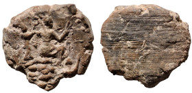 ancient token Tyche seated right getting crowned. (20mm, 2,58g)