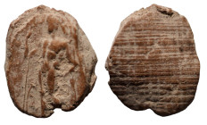 ancient token. deity standing left. (14mm, 0,63g)