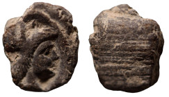 ancient token. head of Athene right. (15mm, 1,75g)