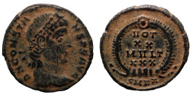 Constans. (347-348 AD). Æ Follis. (16mm, 1,85g) Kyzikos. Obv: D N CONSTANS P F AVG. pearl-diademed bust of Constans right. Rev: VOT / XX / MVLT / XXX....
