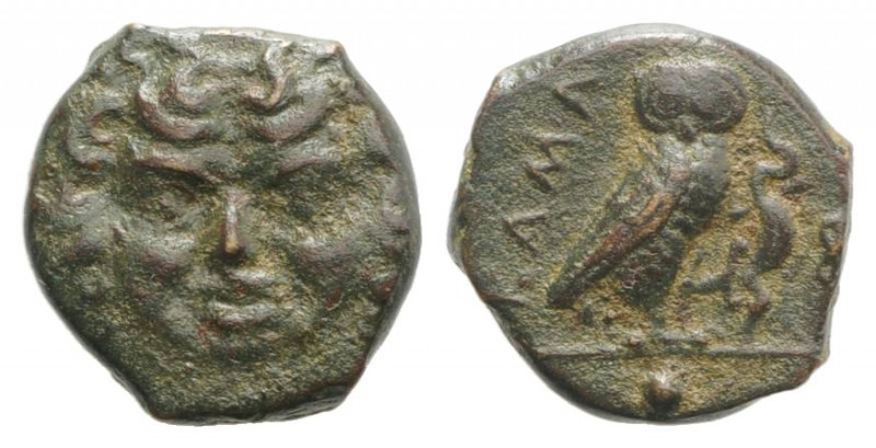 Sicily, Kamarina, c. 420-405 BC. Æ Onkia (11mm, 1.59g, 9h). Facing gorgoneion. R...