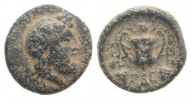 Islands of Thessaly, Peparethos, 4th-3rd centuries BC. Æ Chalkous (12mm, 1.99g, 9h). Bearded head of Dionysos r., wearing ivy wreath. R/ Π-Ε, Kantharo...