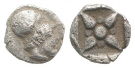 Asia Minor, Uncertain mint, 5th century BC. AR Hemiobol (6mm, 0.41g). Helmeted head of Athena r. R/ Star of four rays; pellets between rays; all withi...