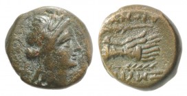 Ionia, Smyrna, c. 190-170 BC. Æ (11mm, 2.10g, 12h). Dionysos, magistrate. Laureate head of Apollo r. R/ Two hands in caestus; palm branch to l. and r....