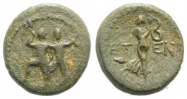 Pisidia, Etenna, c. 1st century BC. Æ (18mm, 4.83g, 12h). Two men standing side by side; the l. brandishing double-axe, the r. sickle. R/ Nymph advanc...