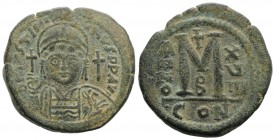 Justinian I (527-565). Æ 40 Nummi (35mm, 19.42g, 1h). Constantinople, year 18 (544/5). Helmeted and cuirassed facing bust, holding globus cruciger and...