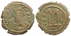 Maurice Tiberius (582-602). Æ 40 Nummi (30mm, 11.42g, 6h). Nicomedia, year 6 (587/8). Helmeted and cuirassed bust facing, holding globus cruciger and ...